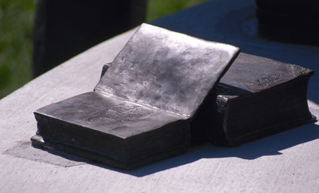 Detail of the Jack Trice memorial statue on Iowa State campus, featuring open books. The statue was financed by students' fundraising efforts in 1988.