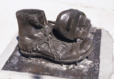 Detail of the Jack Trice memorial statue on Iowa State campus, featuring football cleats. The statue was financed by students' fundraising efforts in 1988.